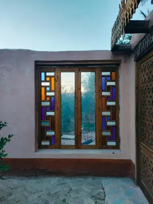 a window in a house with stained glass at Abou El Leef villa in Luxor