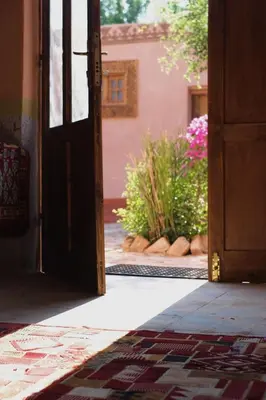 an open door with a garden in the background at Abou El Leef villa in Luxor