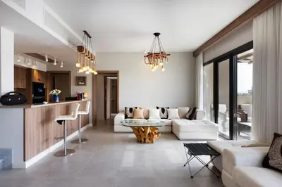a living room with a couch and a table at Fanadir Marina Front Penthouse with Pool in Hurghada