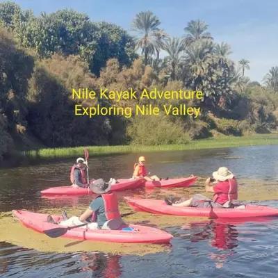 a group of people on kayaks on the water at Nile Kaiak Adventure in Aswan