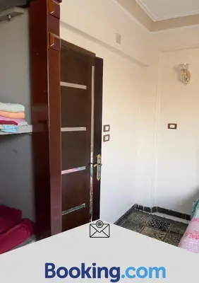 a room with a door open in a bedroom at Aswan apartment-Center of Aswan in Aswan