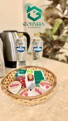 a basket of chips and water bottles on a counter at El Gouna west golf Y12 in Hurghada
