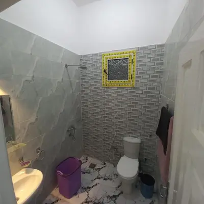 a bathroom with a toilet and a sink at Nora House in Luxor