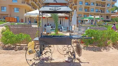 a bird feeder in front of a building at Tertels beach resort F 1-7 in Hurghada