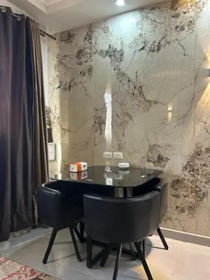 a dining room with a black table and black chairs at scandic resort 523 in Hurghada