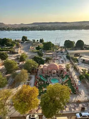 an aerial view of a park next to the water at The best view of the Nile in Naj‘ al ‘Amrāb