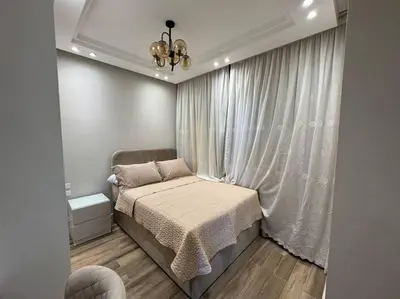 a small bedroom with a bed and a window at Luxury Villa Hurghada Pool Near Senzo Mall 3story in Hurghada