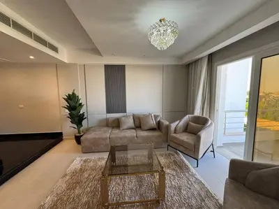 a living room with a couch and chairs and a chandelier at Luxury Villa Hurghada Pool Near Senzo Mall 3story in Hurghada