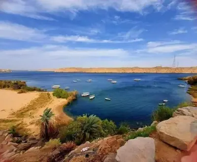 a large body of water with boats in it at البيت النوبى in Aswan