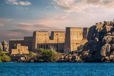 a large building on the shore of a body of water at البيت النوبى in Aswan