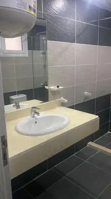 a bathroom with a sink and a mirror at Red Sea Hurghada Summer in Winter in Hurghada