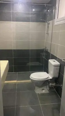 a bathroom with a toilet and a shower at Red Sea Hurghada Summer in Winter in Hurghada