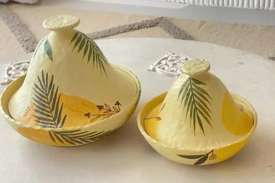 two vases sitting on top of a table at Lofty & Lavish 3 BDR Swan Lake El Gouna in Hurghada