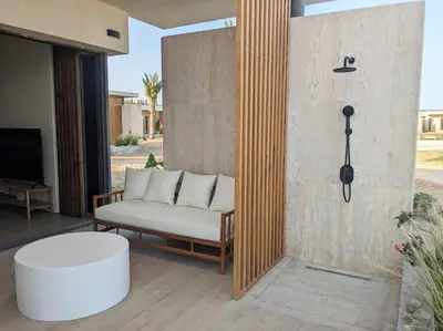 a living room with a couch and a table at Magical Cabana Steps From Beach & Pool in Hurghada