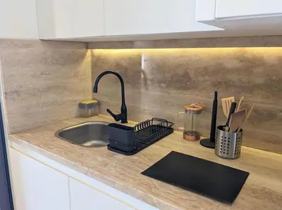 a kitchen counter top with a sink and a sink at Magical Cabana Steps From Beach & Pool in Hurghada