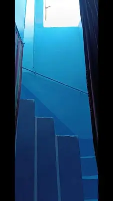 an empty room with blue stairs and a window at نعتذر الحجز مقفول فتره من 1 يناير26 in Aswan