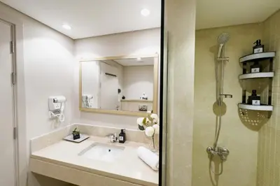 a bathroom with a sink and a mirror at Staggering & Soothing 2 BDR w Pool View Free Pool & Beach Access in Hurghada
