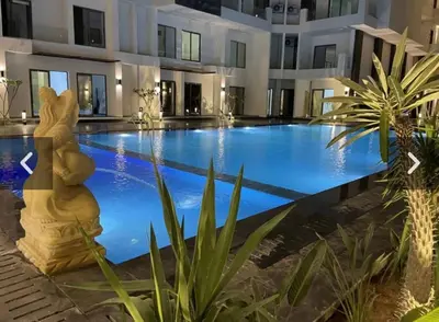 a swimming pool in the middle of a building at Imperial Beach Resort in Hurghada