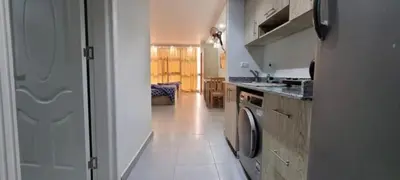a kitchen with a washer and dryer in it at Scandic Resort in Hurghada