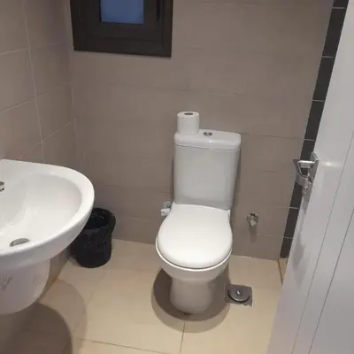 a bathroom with a white toilet and a sink at Studio El Gouna G Cribs Hotel in Hurghada