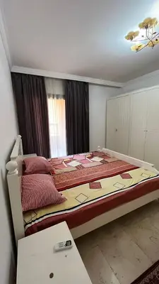 a bedroom with a large bed in a room at Esplanada hotel Apartments in Hurghada