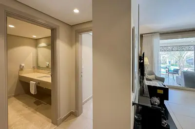 a room with a bathroom with a sink and a mirror at Summer Breeze 2 BDR Pool Sea View Mangroovy in Hurghada