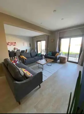 a large living room with couches and a table at Water front luxury 3BD villa in Hurghada
