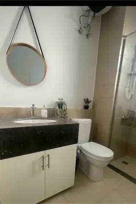 a bathroom with a toilet and a sink and a mirror at 3 Bedrooms with roof in Makadi in Hurghada