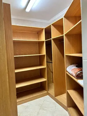 a walk in closet with wooden shelves at Private villa in Hurghada in Hurghada
