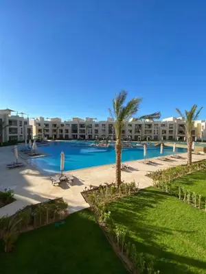 an aerial view of a resort with a swimming pool at M Residence with Pool View & Beach Access - El Gouna, Hurghada in Hurghada