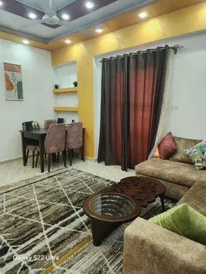 a living room with a couch and a table at Abeer Suites 5 in Hurghada
