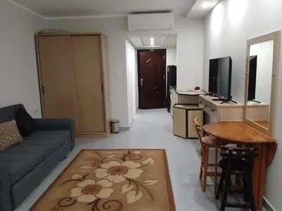 a living room with a couch and a table at Scandic Resort Hurghada Red Sea in Hurghada
