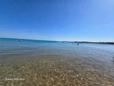 a group of people swimming in the water at Sea view Prinessa Resort in Hurghada