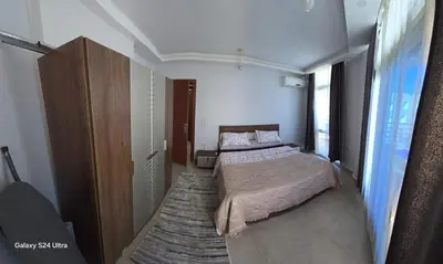 a bedroom with a bed and a large window at Sea view Prinessa Resort in Hurghada