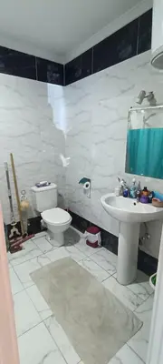 a bathroom with a toilet and a sink at Cozy 1 bedroom Seaview escape in Hurghada