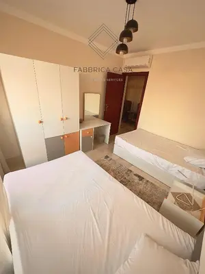 a bedroom with two beds and a mirror at Astonishing Twin Villa in O-C in Coraya Bay