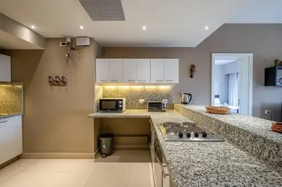 a kitchen with granite counter tops and a stove at Ocean View: Spacious 2-Bed Apt in Hurghada