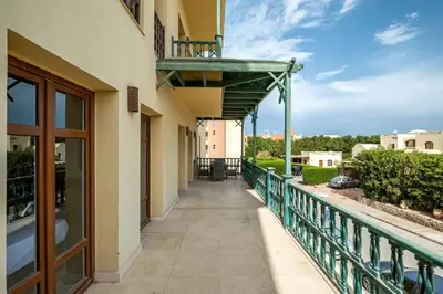 a balcony of a building with a walkway at Ocean View: Spacious 2-Bed Apt in Hurghada