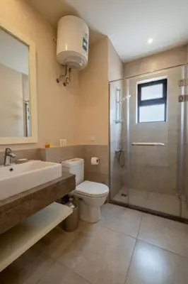 a bathroom with a sink toilet and a shower at Luxury 4BR + Nanny Villa • Ancient Sands in Hurghada