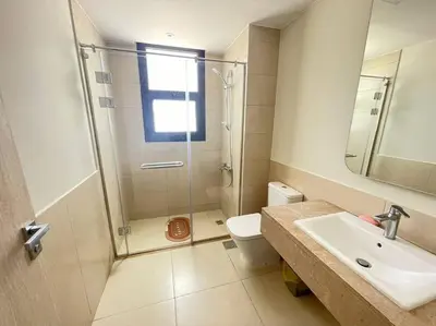 a bathroom with a shower and a sink and a toilet at Shedwan 2 Bdr Ground Floor in Hurghada