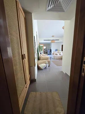 a hallway with a door and a living room at Somabay Beach House BW in Hurghada
