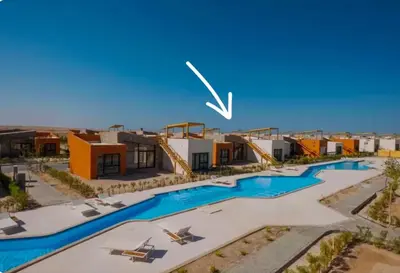 an aerial view of a resort with a swimming pool at Somabay Beach House BW in Hurghada