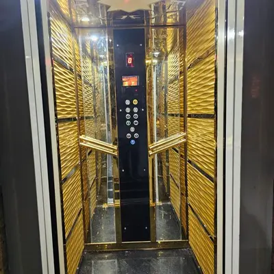 an empty elevator in a room with wooden walls at Dody rent services in Jazīrat al ‘Awwāmīyah