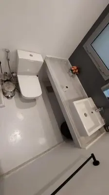 a bathroom with a toilet and a sink at Modern chalet at el gouna Swan Lake compound with Swimable lagoon view in Hurghada