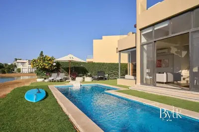 a swimming pool in the backyard of a house at BYTK - Villa La Calma in Hurghada