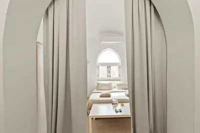 a room with two beds and a window at The Downtown Getaway Studio in Hurghada
