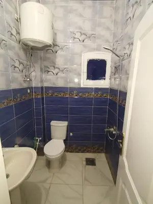 a bathroom with a toilet and a sink at Hmmam in Quseir