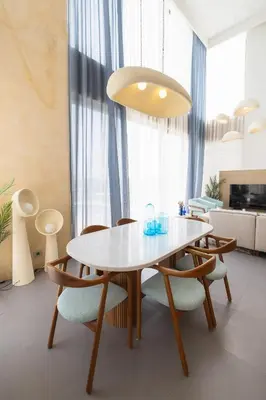 a dining room with a white table and chairs at El Gouna at Birdnest in Hurghada