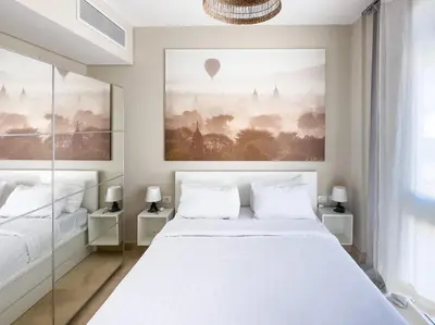 a bedroom with a large white bed and a window at El Gouna at Birdnest in Hurghada