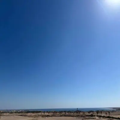 a blue sky with the sun in the distance at Luxury Chalet in Alsaraya, Overlooking All of Sahl Hasheesh with Stunning Pool & Red Sea Views in Hurghada